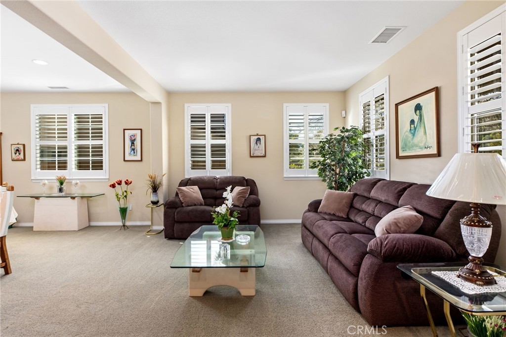 34641 Irwin Street Beaumont, CA 92223 - Photo 6 of 63 a living room with furniture and a large window