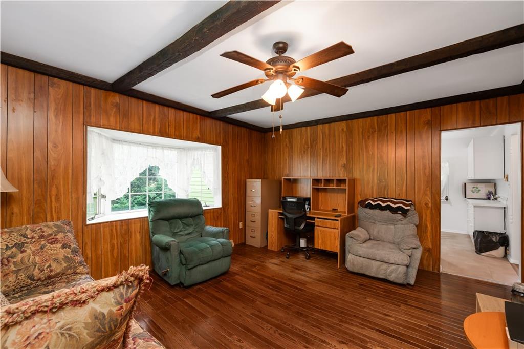 411 Harmony Road Baden, PA 15005 - Photo 8 of 25 a living room with furniture and a large window