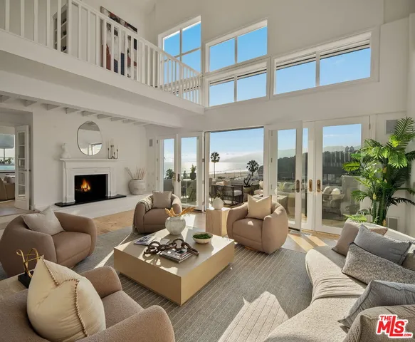 a living room with furniture or couch and a fireplace