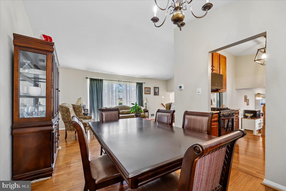 5001 Aspen Hill Road Rockville, MD 20853 - Photo 14 of 68 a view of a dining room with furniture window and wooden floor