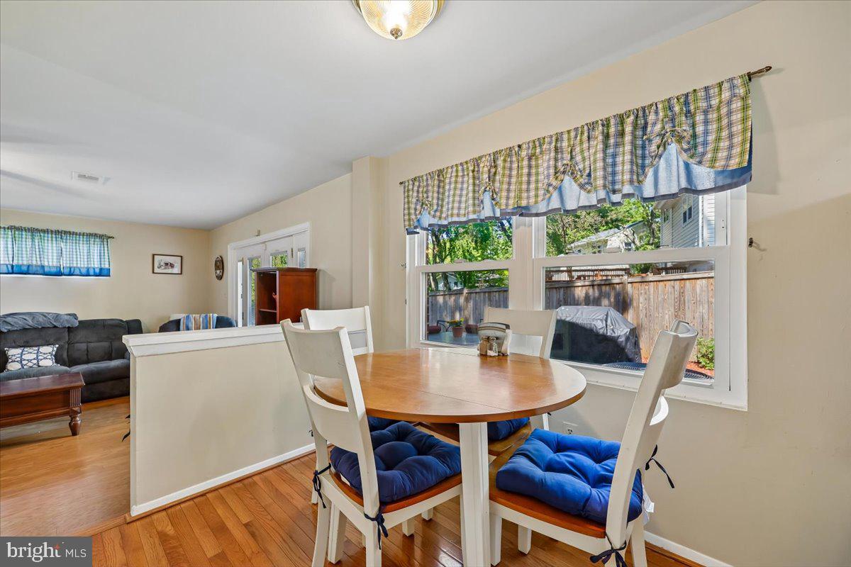 5001 Aspen Hill Road Rockville, MD 20853 - Photo 20 of 68 a living room with furniture a table and a potted plant