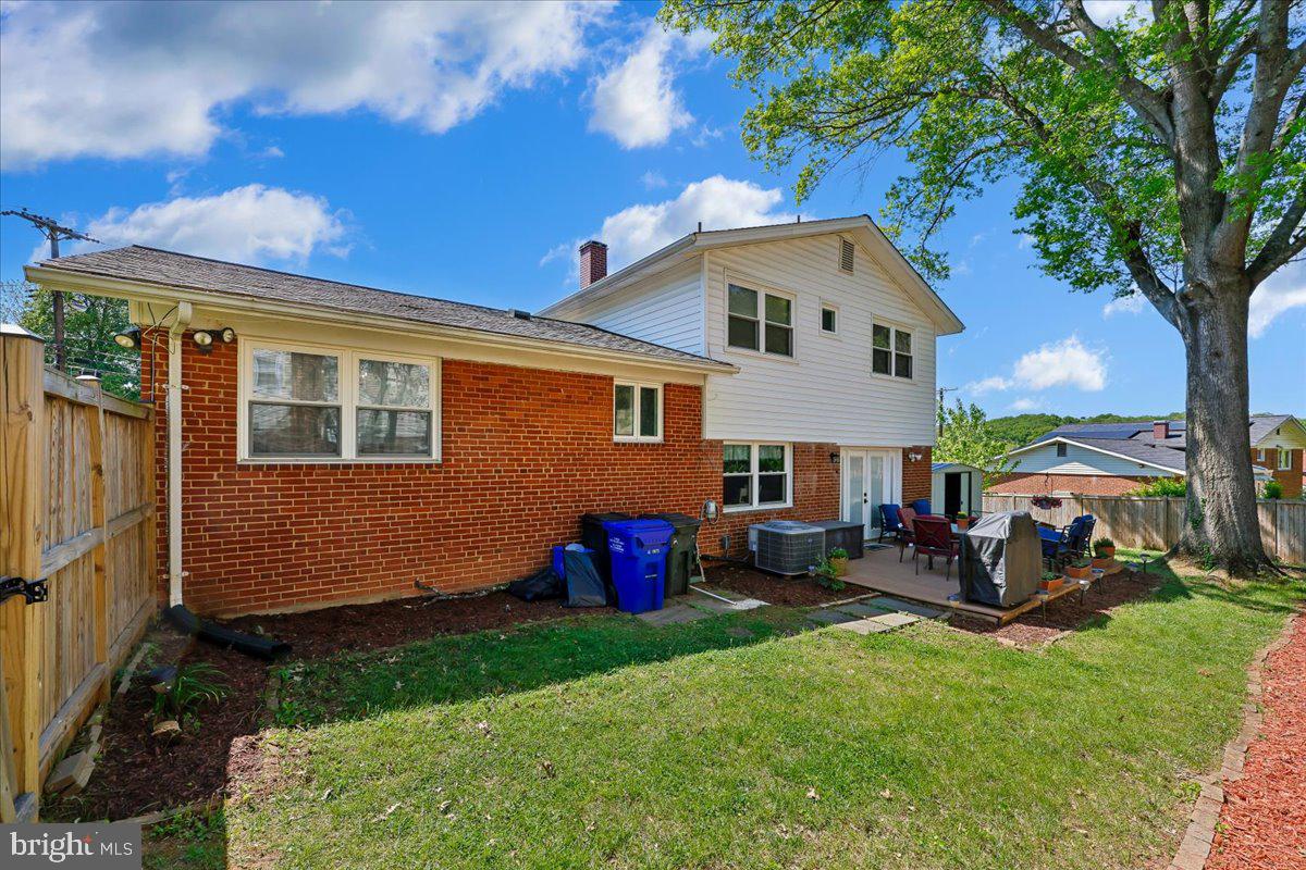 5001 Aspen Hill Road Rockville, MD 20853 - Photo 2 of 68 a front view of a house with a yard and outdoor seating