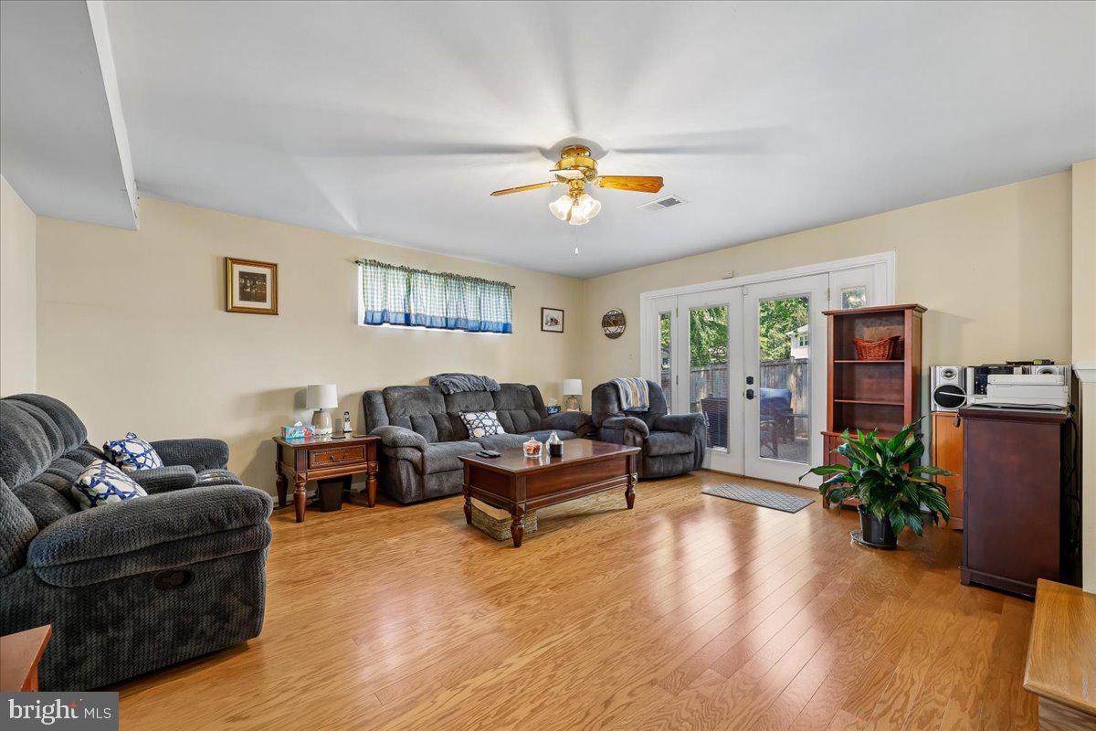 5001 Aspen Hill Road Rockville, MD 20853 - Photo 24 of 68 a living room with furniture potted plant and a window