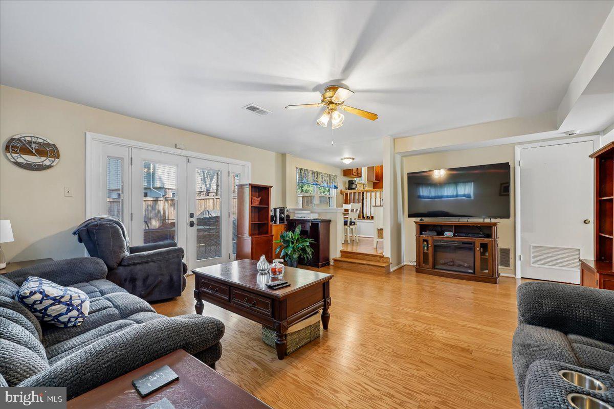 5001 Aspen Hill Road Rockville, MD 20853 - Photo 25 of 68 a living room with furniture and a flat screen tv