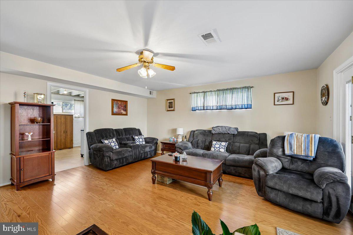 5001 Aspen Hill Road Rockville, MD 20853 - Photo 27 of 68 a living room with furniture and a flat screen tv