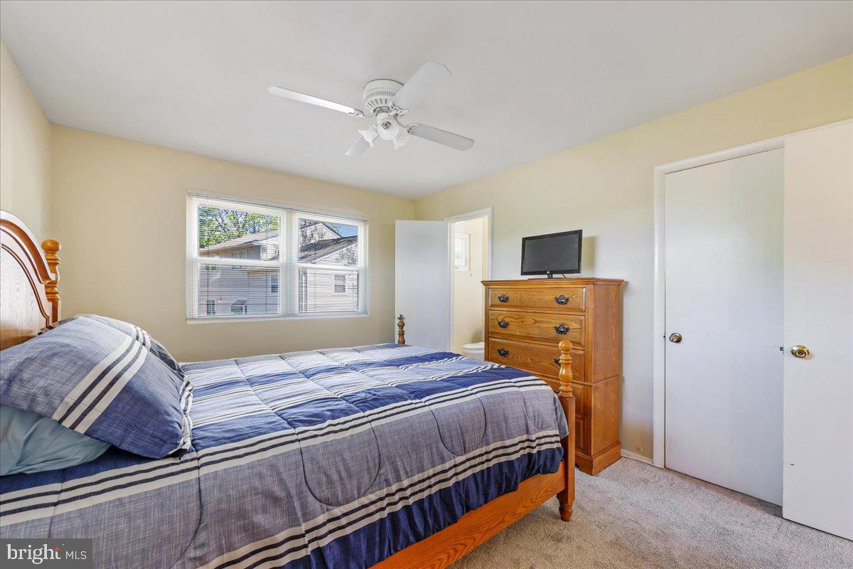 5001 Aspen Hill Road Rockville, MD 20853 - Photo 31 of 68 a bedroom with a bed and dresser