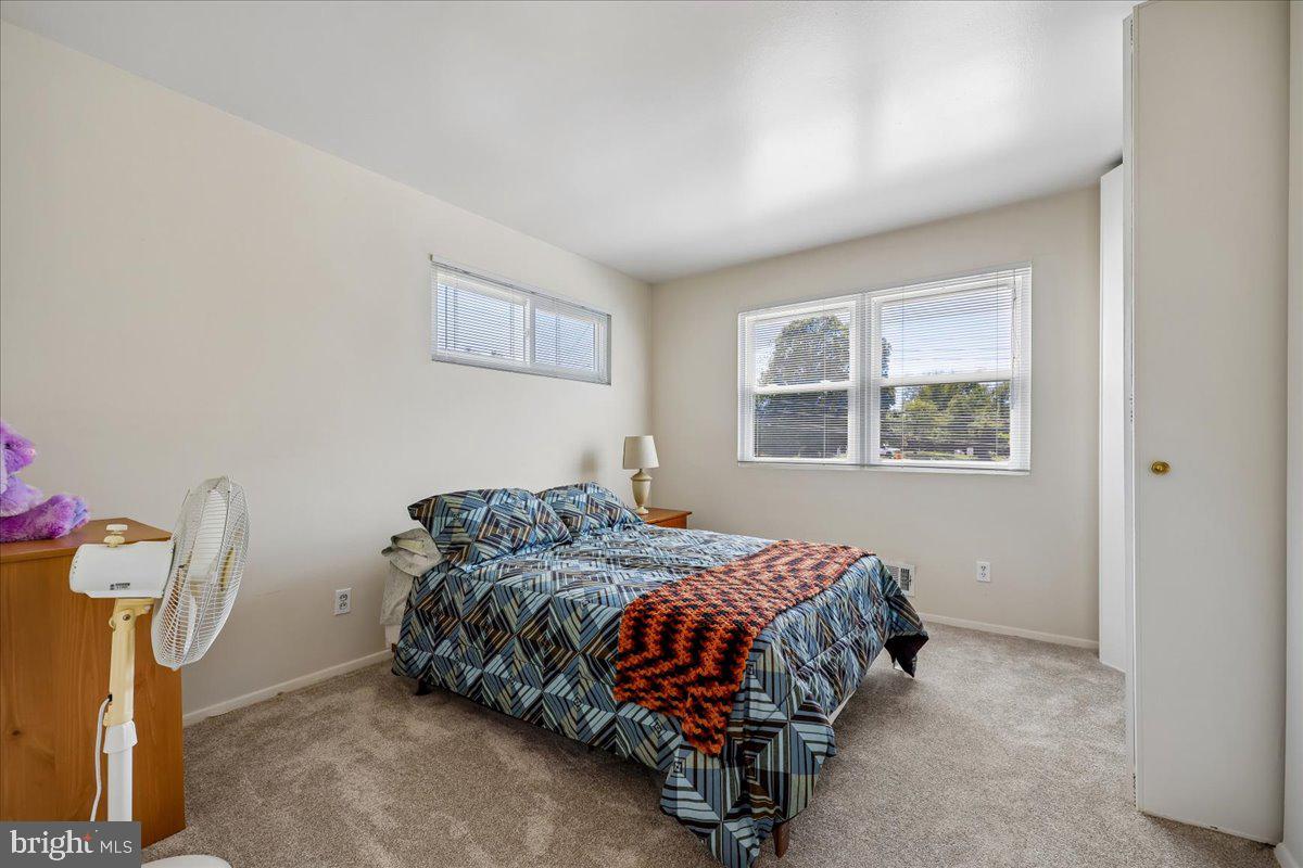 5001 Aspen Hill Road Rockville, MD 20853 - Photo 34 of 68 a bedroom with a bed and a window