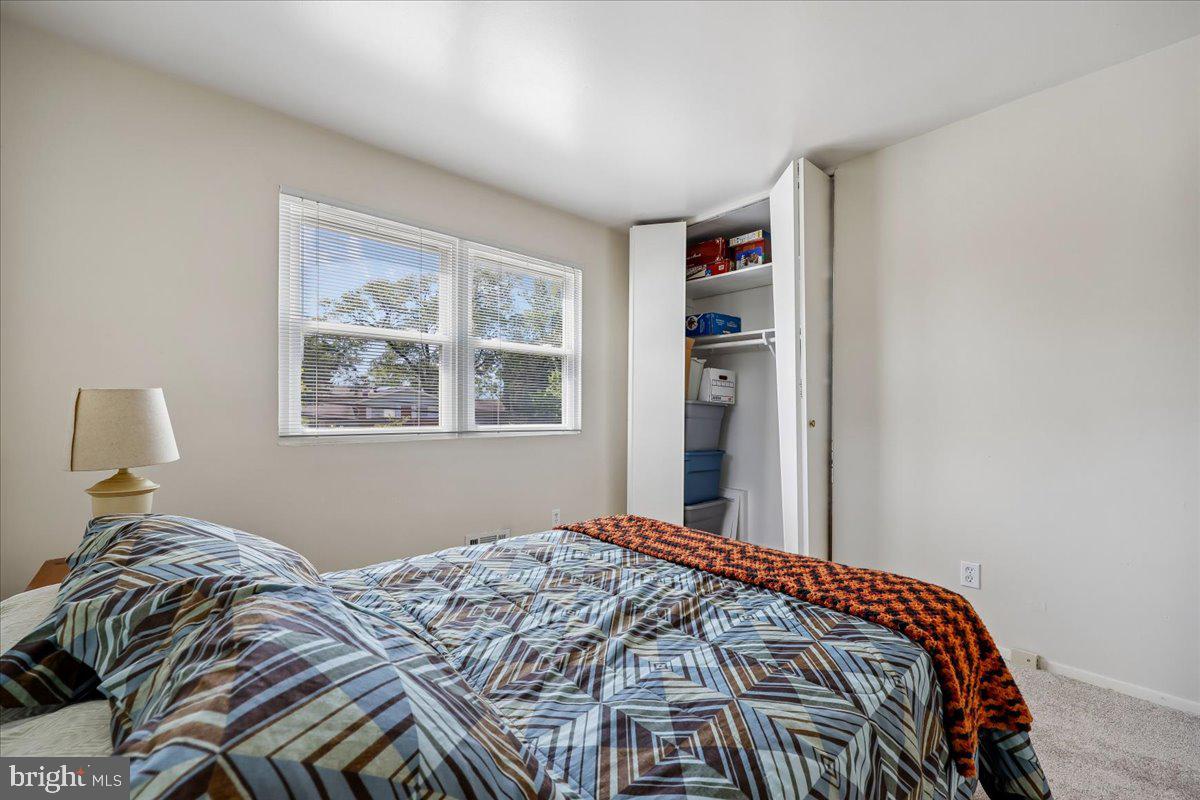 5001 Aspen Hill Road Rockville, MD 20853 - Photo 35 of 68 a bedroom with a bed and a window