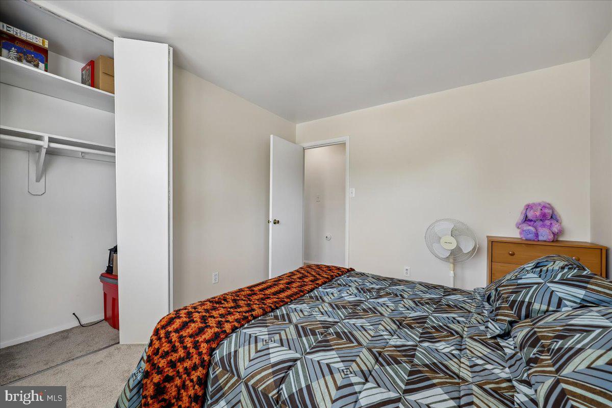5001 Aspen Hill Road Rockville, MD 20853 - Photo 36 of 68 a bedroom with a bed and a closet