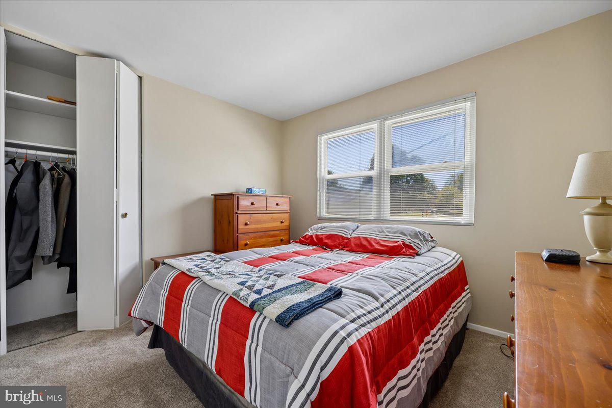 5001 Aspen Hill Road Rockville, MD 20853 - Photo 43 of 68 a bedroom with a bed and a window