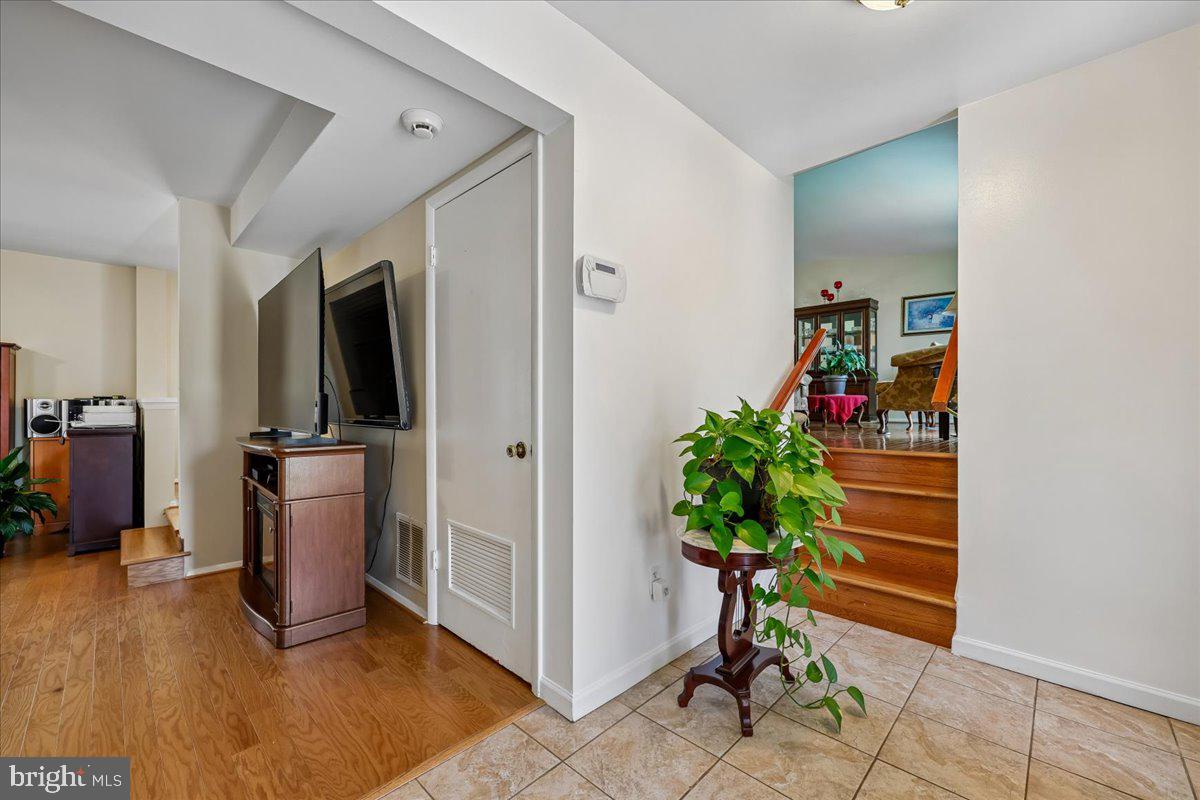 5001 Aspen Hill Road Rockville, MD 20853 - Photo 5 of 68 a living room with furniture and a potted plant