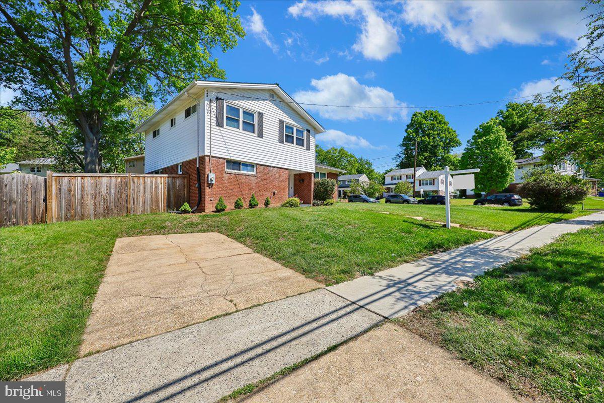 5001 Aspen Hill Road Rockville, MD 20853 - Photo 55 of 68 a front view of a house with a yard