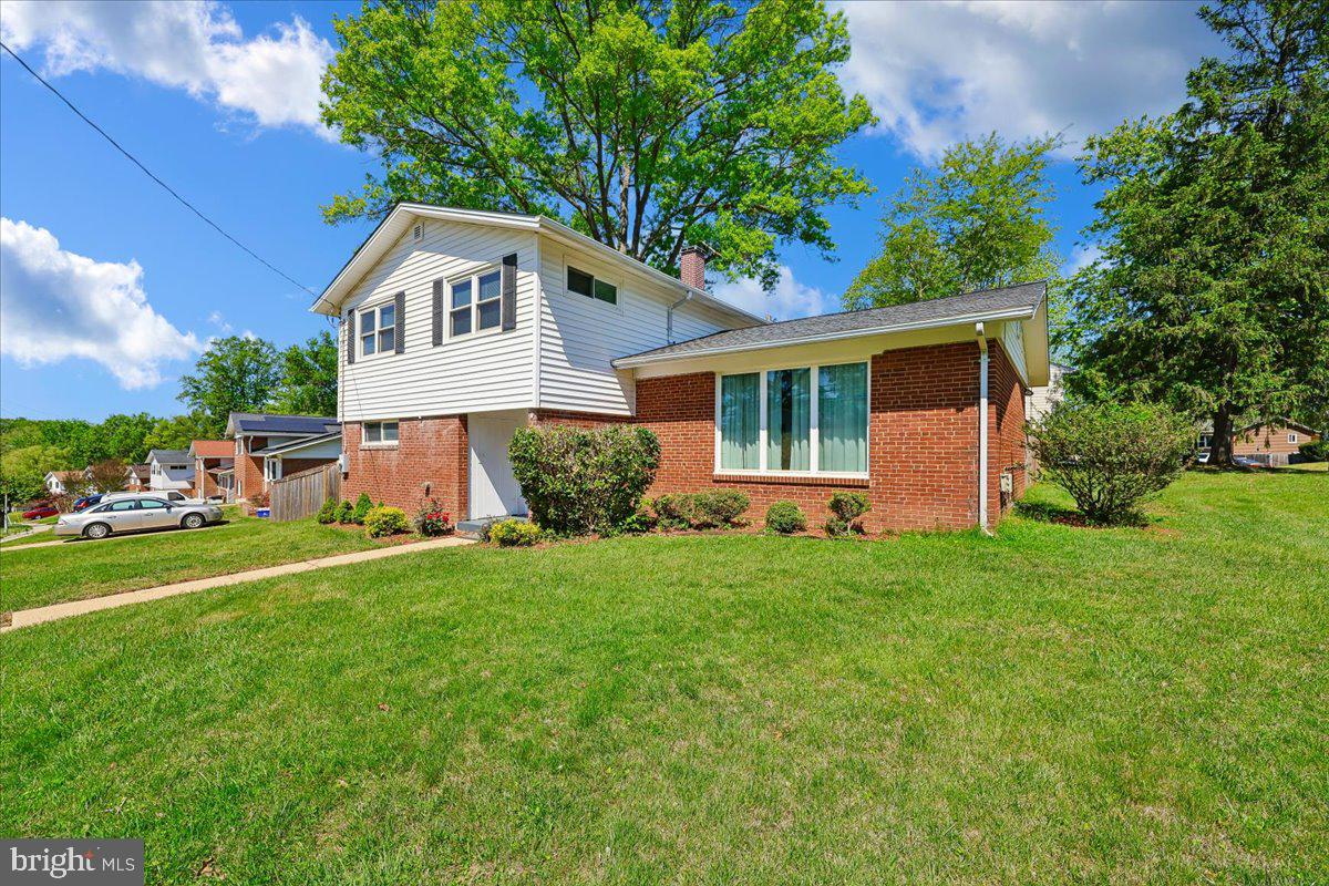 5001 Aspen Hill Road Rockville, MD 20853 - Photo 56 of 68 a front view of house with yard and green space