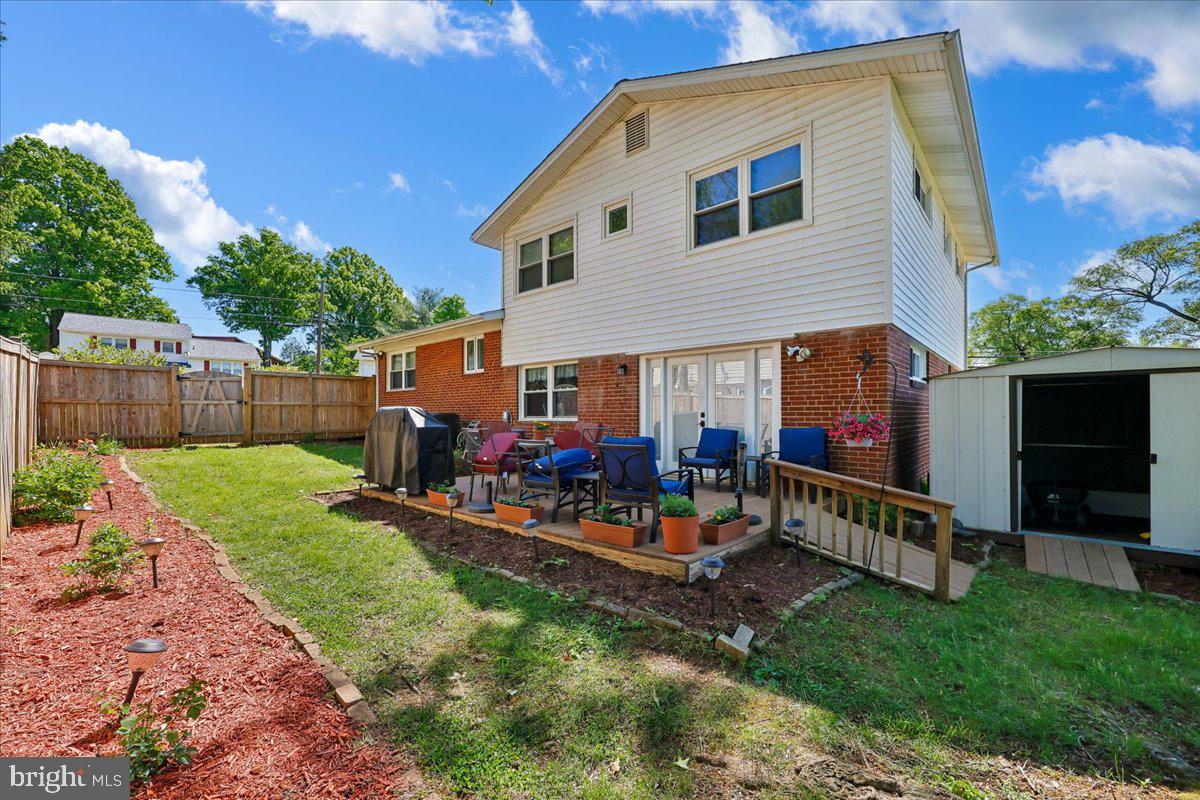5001 Aspen Hill Road Rockville, MD 20853 - Photo 59 of 68 a view of an house with backyard space and wooden fence