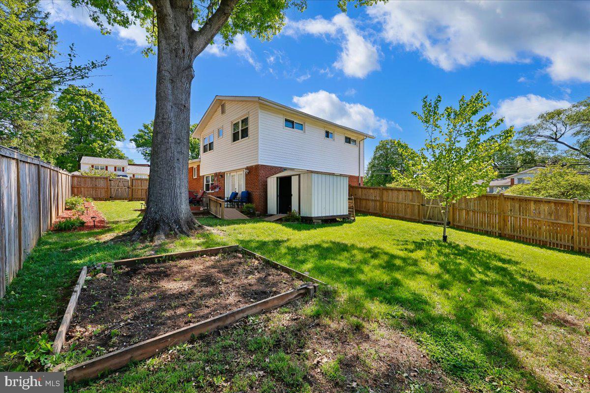 5001 Aspen Hill Road Rockville, MD 20853 - Photo 61 of 68 a front view of a house with garden