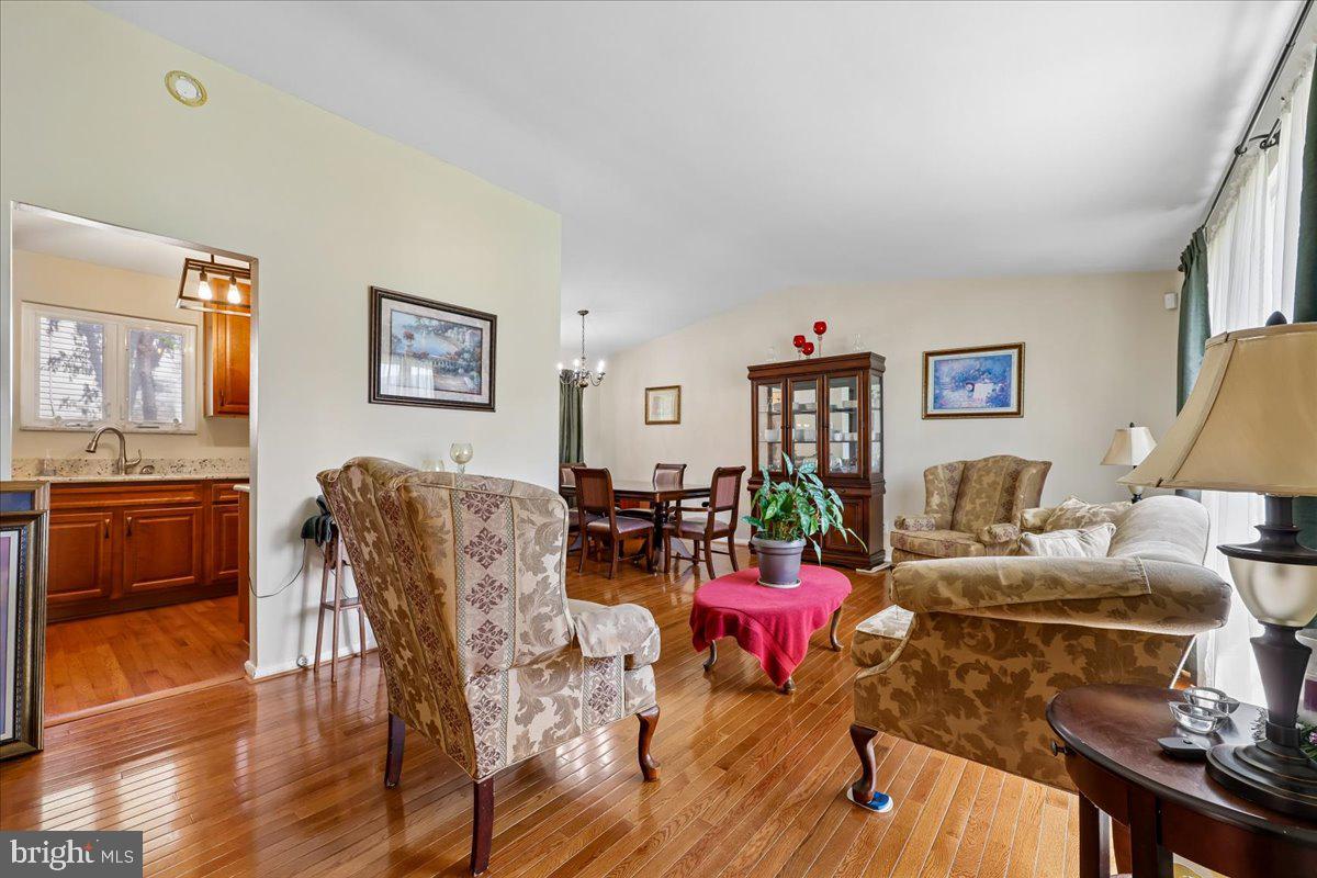 5001 Aspen Hill Road Rockville, MD 20853 - Photo 8 of 68 a living room with furniture and wooden floor