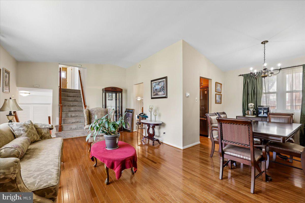 5001 Aspen Hill Road Rockville, MD 20853 - Photo 10 of 68 a view of a dining room with furniture window and wooden floor