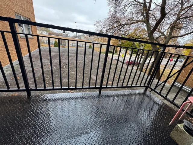 a view of outdoor space with wooden floor