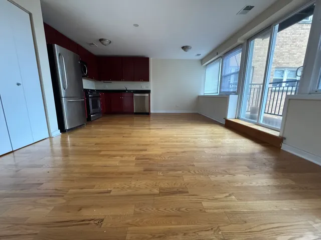 a view of room with window and furniture