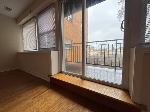 a view of entryway with wooden floor
