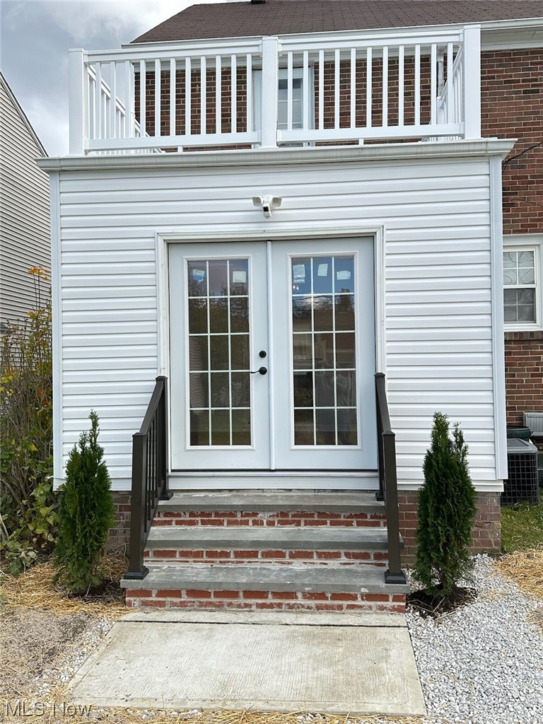 3688 Rolliston Road Cleveland, OH 44120 - Photo 43 of 44 Doorway to property with french doors, a balcony, and central AC unit