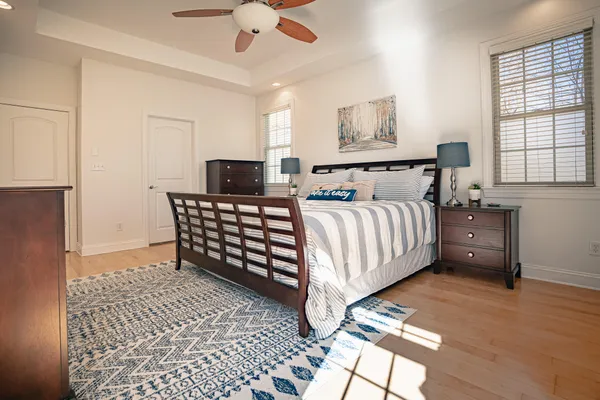a bathroom with a shower sink vanity and mirror