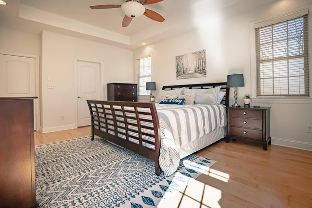 a bathroom with a shower sink vanity and mirror