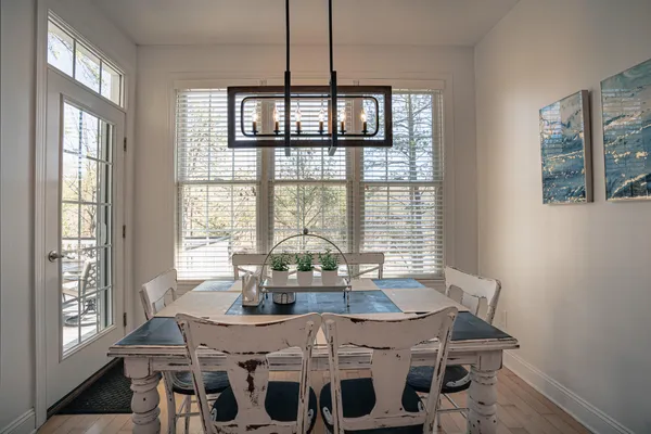 a bathroom with a shower sink vanity mirror and toilet