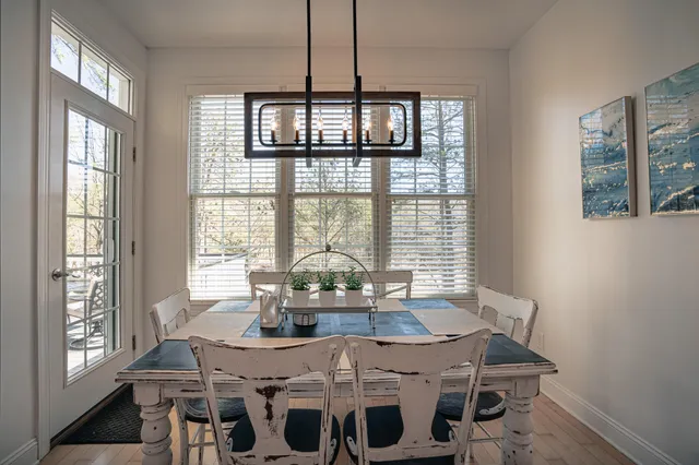 a bathroom with a shower sink vanity mirror and toilet