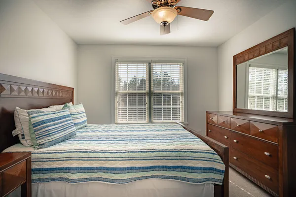 a room with furniture pool table and windows