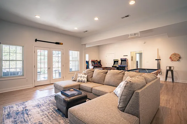 an aerial view of a house with a yard and lake view