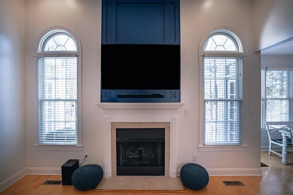 a living room with furniture a couch and kitchen view