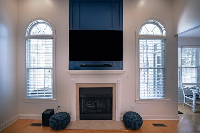 a living room with furniture a couch and kitchen view