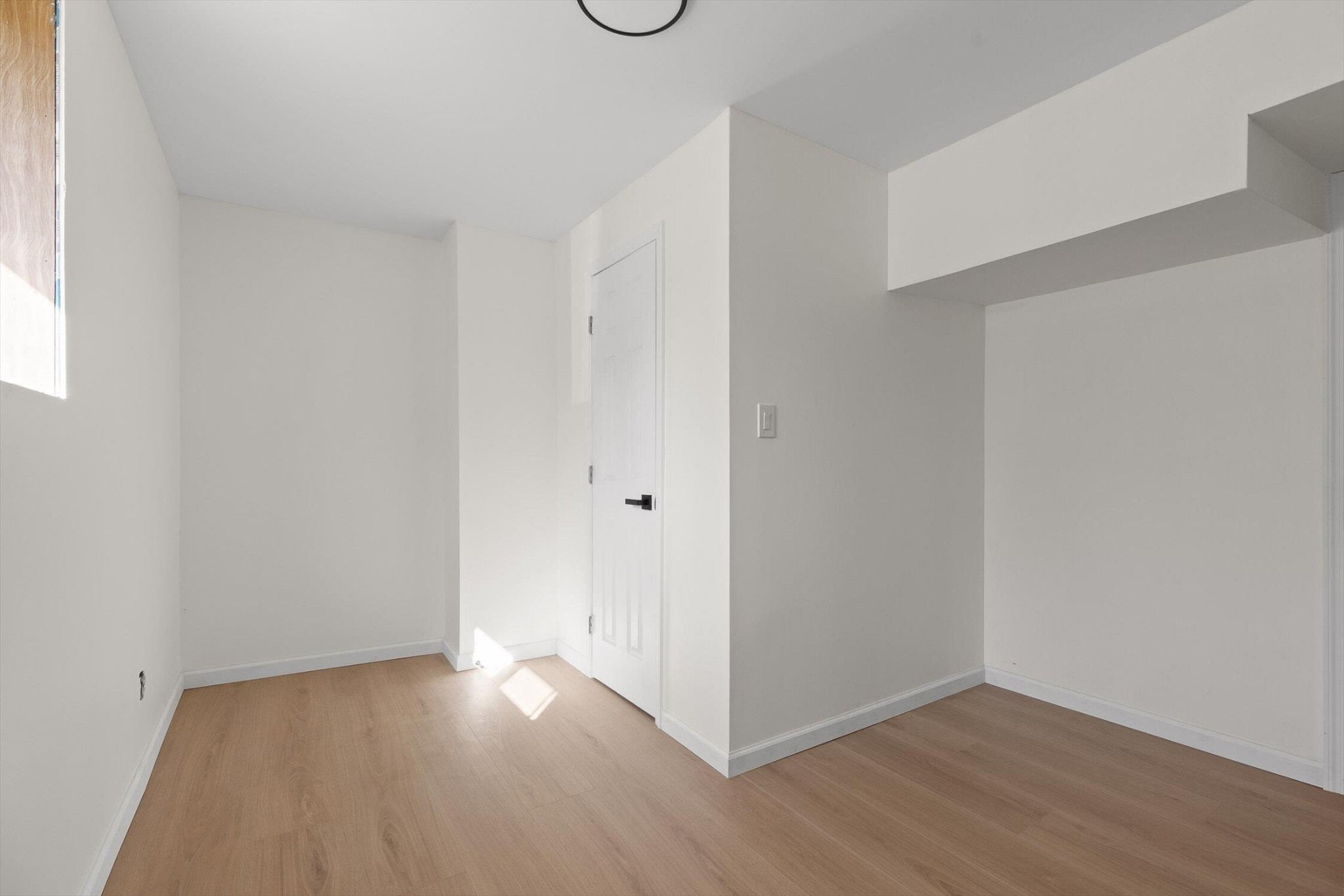 1313 Michael Lane Hixson, TN 37343 - Photo 19 of 24 a view of an empty room with wooden floor and a window
