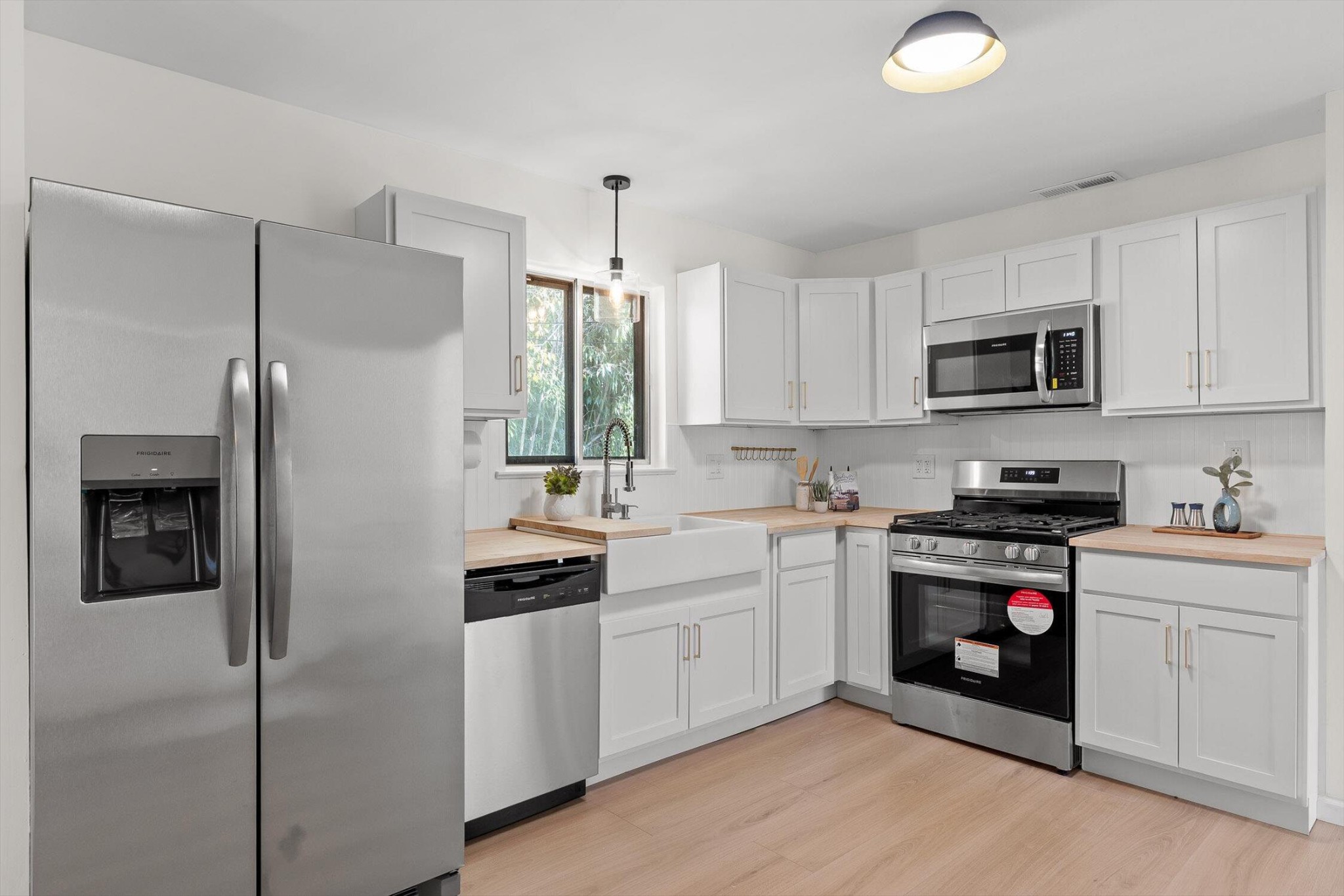 1313 Michael Lane Hixson, TN 37343 - Photo 6 of 24 a kitchen with a sink a stove and refrigerator