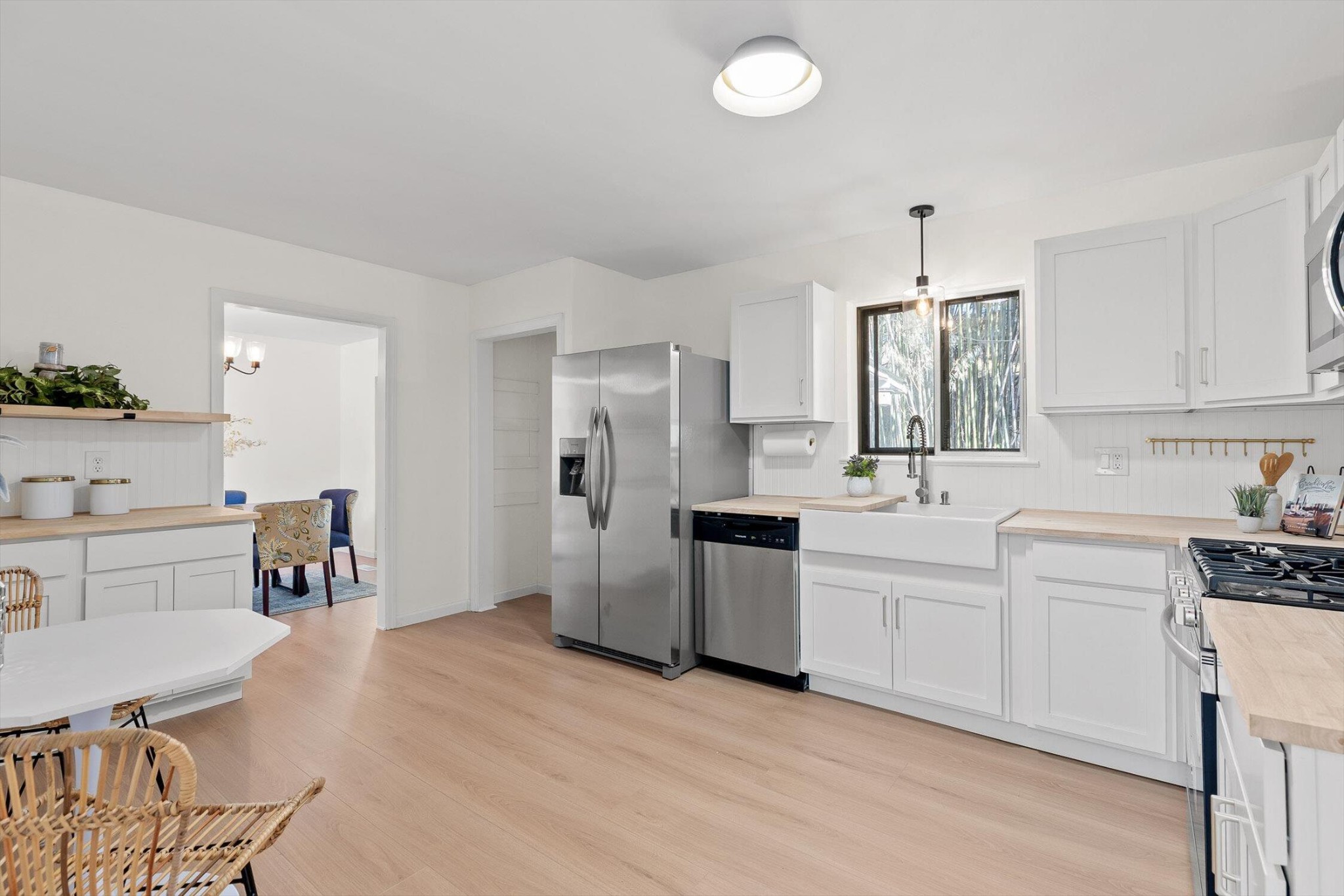 1313 Michael Lane Hixson, TN 37343 - Photo 7 of 24 a kitchen with white cabinets and stainless steel appliances
