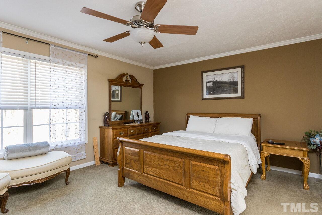 175 Williams Road Spring Hope, NC 27882 - Photo 12 of 30 a bedroom with a bed and a window