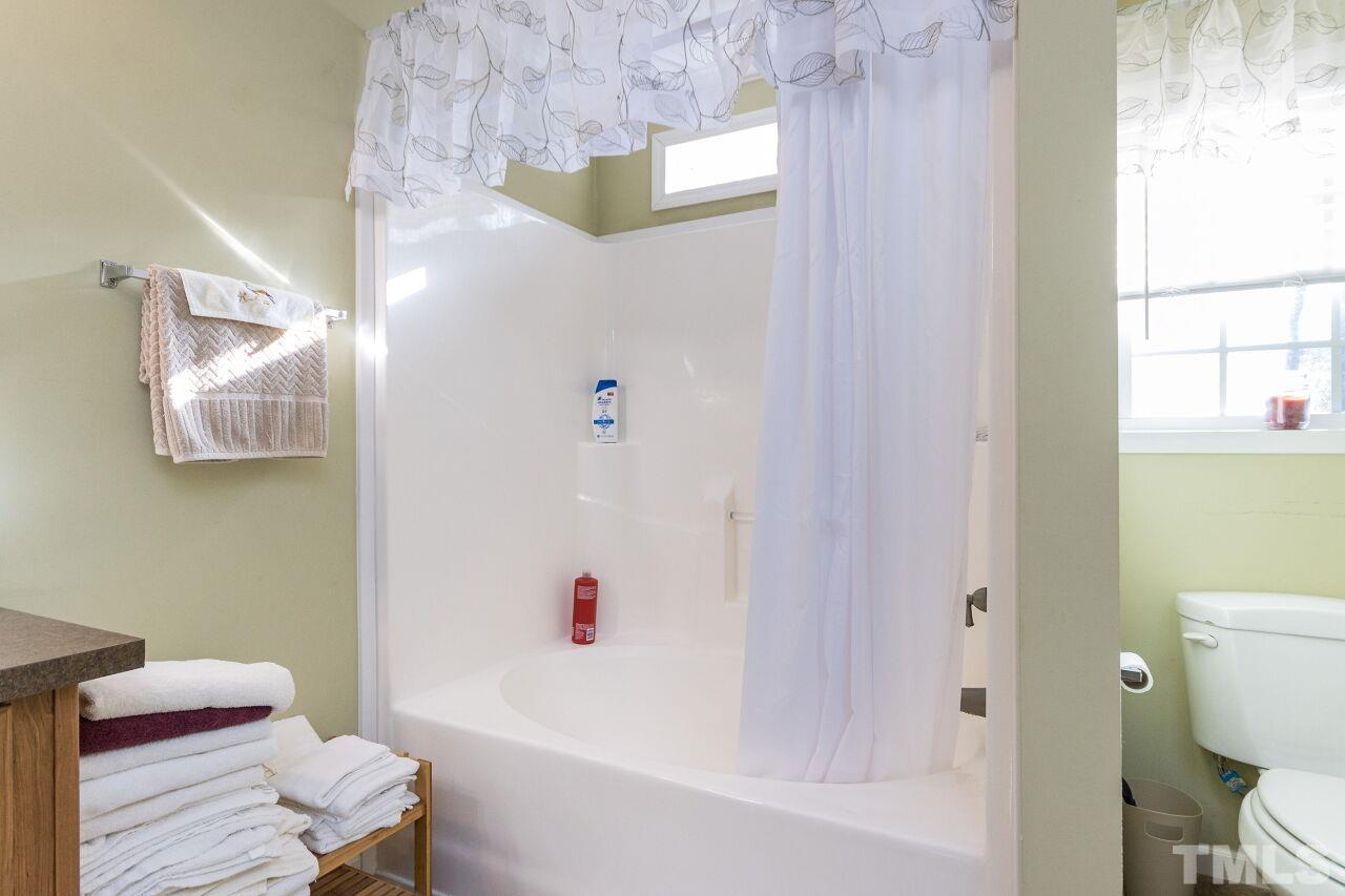 175 Williams Road Spring Hope, NC 27882 - Photo 16 of 30 a white toilet sitting next to a bath tub