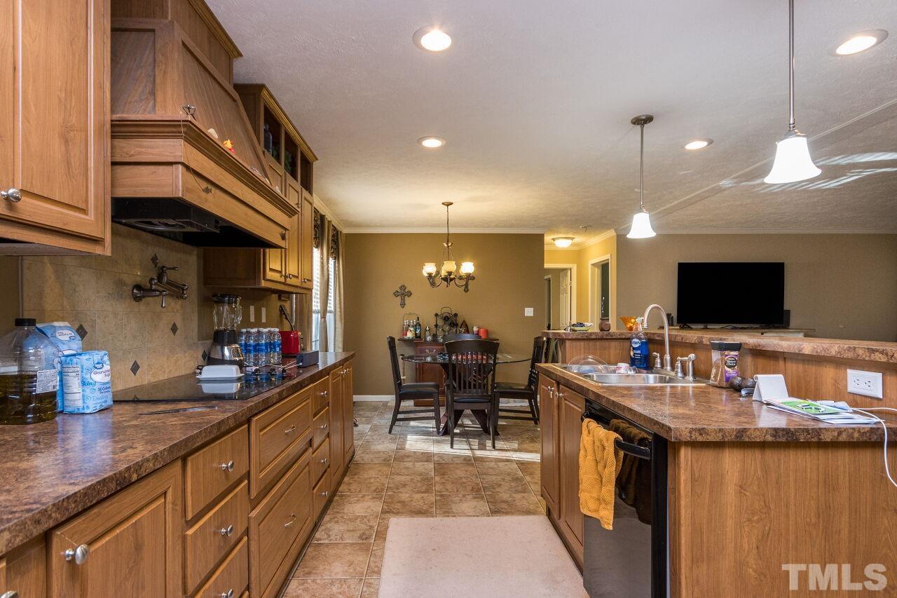 175 Williams Road Spring Hope, NC 27882 - Photo 9 of 30 a kitchen with sink stove and cabinets