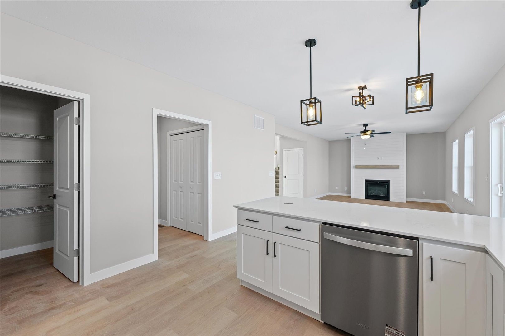 302 Sutton Street Savoy, IL 61874 - Photo 14 of 32 a kitchen with granite countertop white cabinets and white appliances