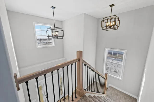 a view of a hallway with windows