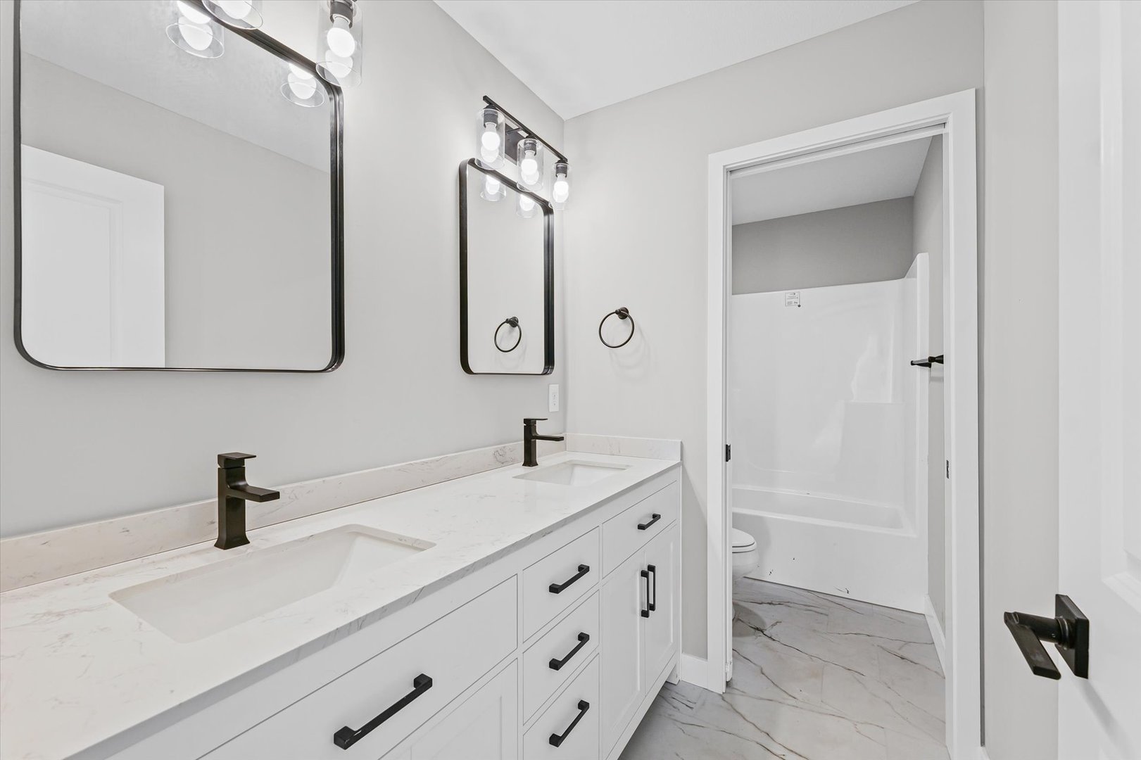 302 Sutton Street Savoy, IL 61874 - Photo 21 of 32 a bathroom with a sink and a mirror
