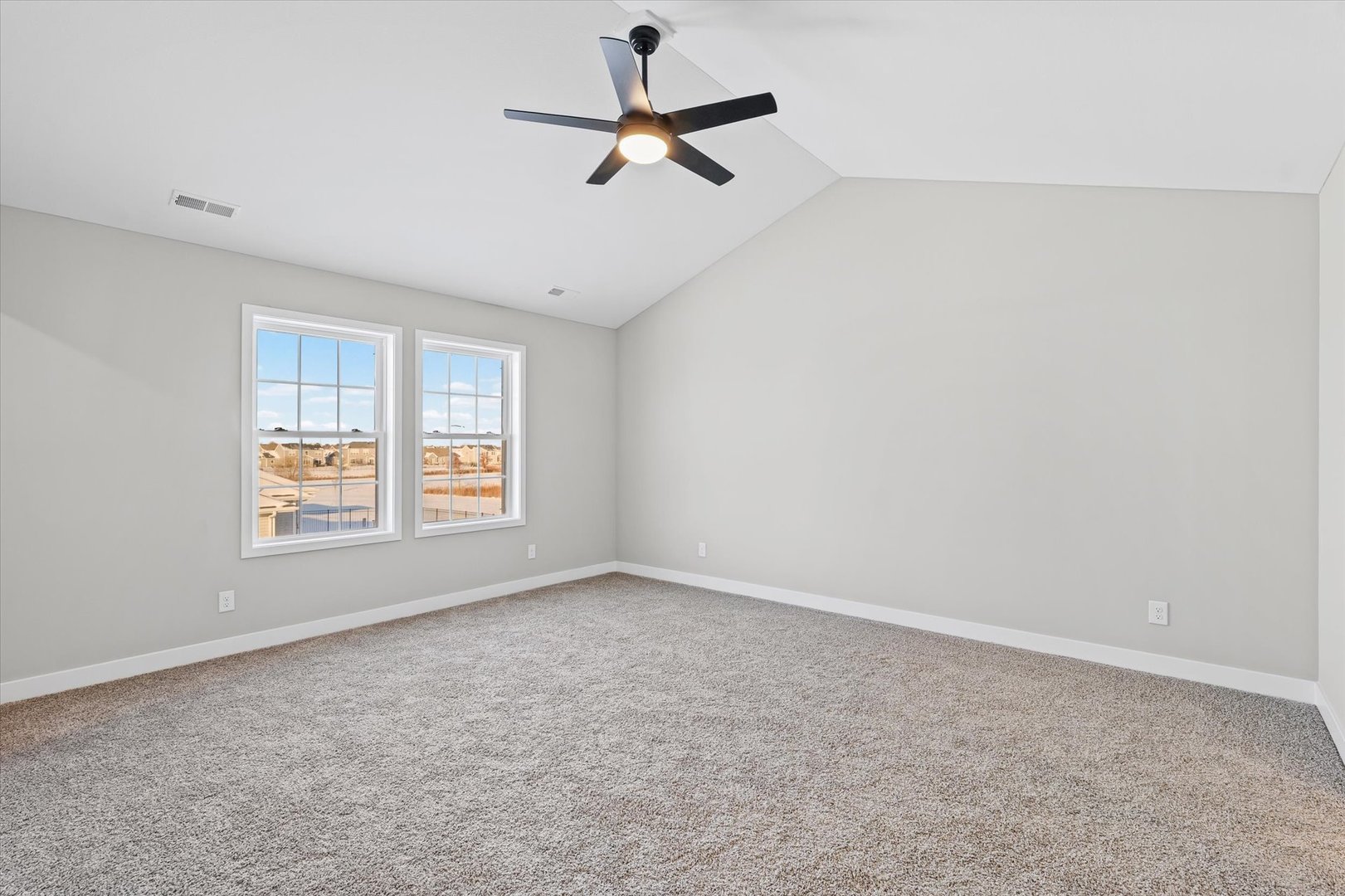 302 Sutton Street Savoy, IL 61874 - Photo 23 of 32 an empty room with a window and a fan