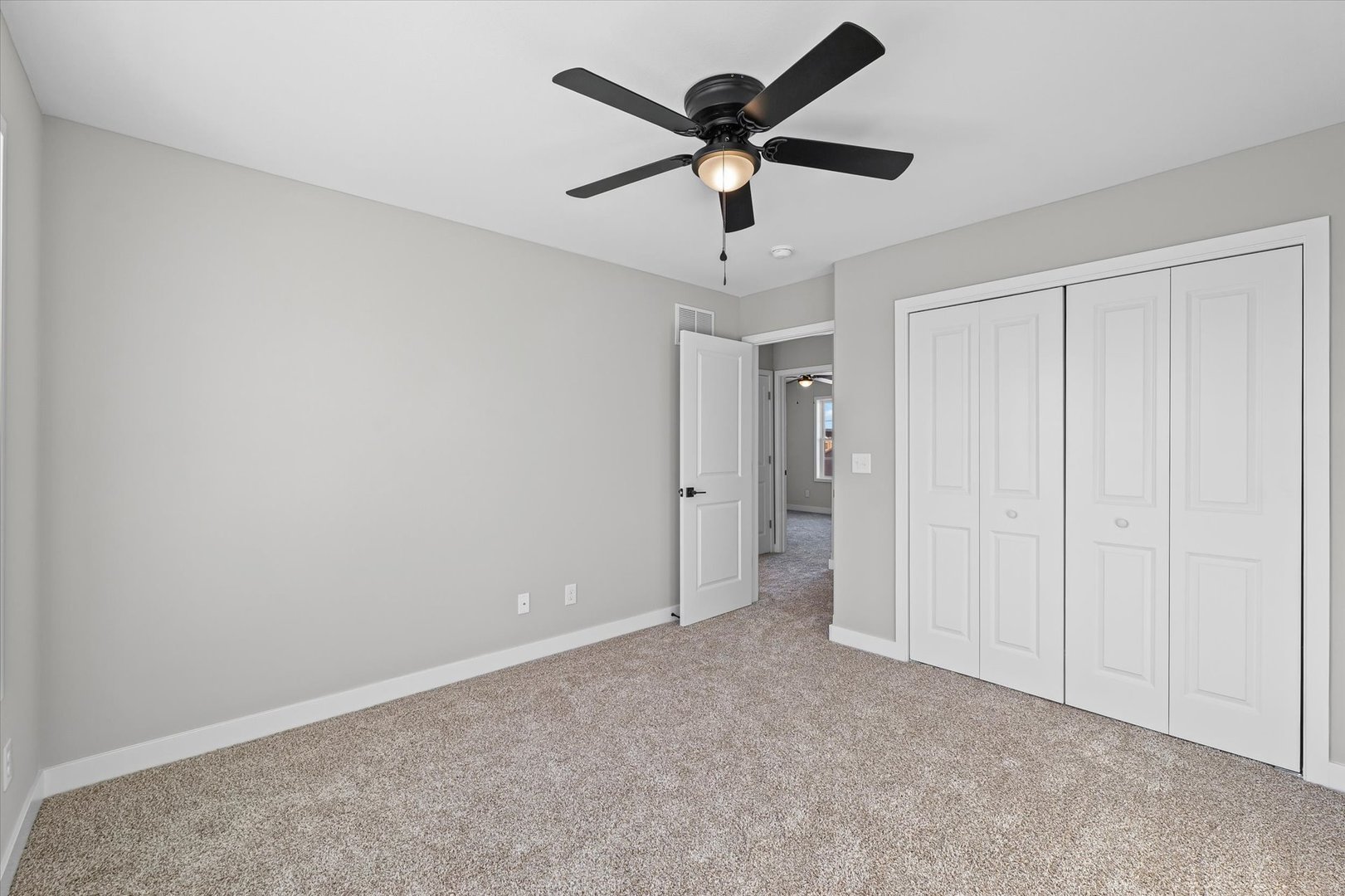 302 Sutton Street Savoy, IL 61874 - Photo 27 of 32 an empty room with a ceiling fan and a ceiling fan