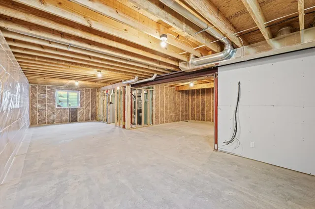 a view of a room with wooden walls