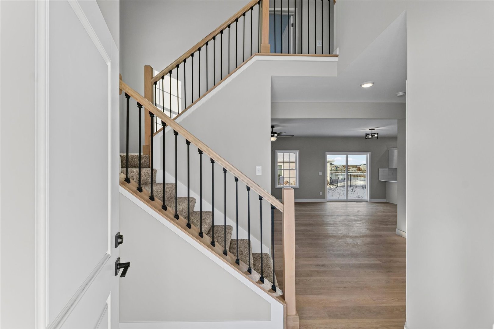 302 Sutton Street Savoy, IL 61874 - Photo 4 of 32 a view of entryway and hall with wooden floor
