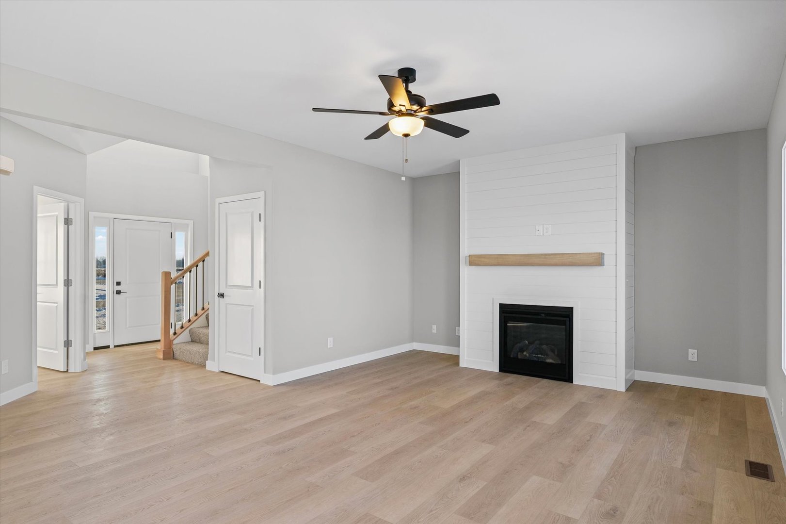 302 Sutton Street Savoy, IL 61874 - Photo 8 of 32 an empty room with closet and a fireplace
