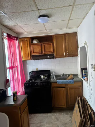 a kitchen with a stove and a sink