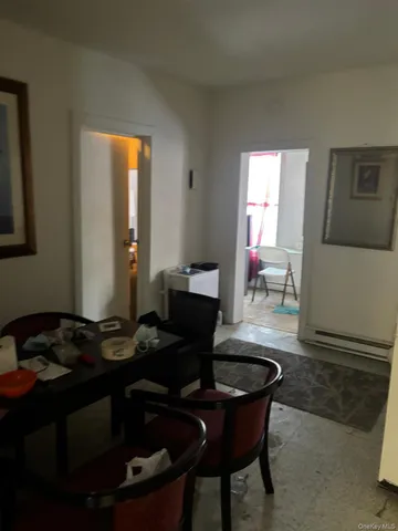 a kitchen with a table chairs and a stove