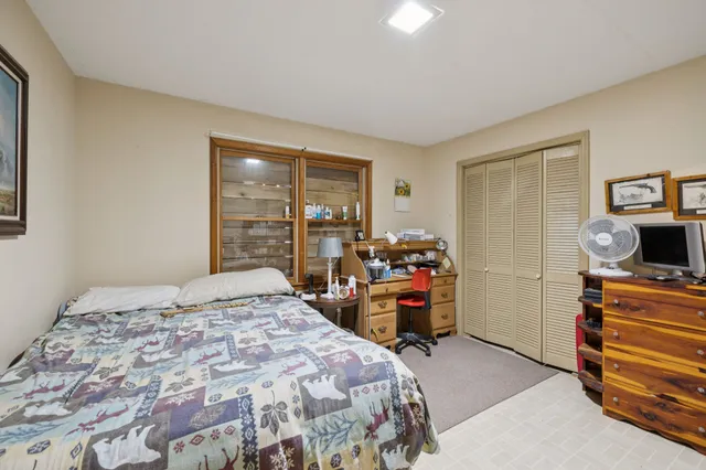 a bedroom with furniture and a window